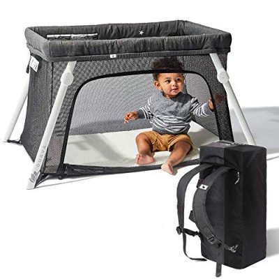 Lotus travel crib with carry case and child 